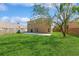 Large backyard with grassy lawn and concrete patio at 1344 Holly Glen Run, Apopka, FL 32703