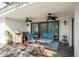 Covered patio with seating area and ceiling fans at 8984 Houston Pl # 103, Orlando, FL 32819