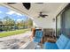 Relaxing waterfront patio with seating and ceiling fans at 8984 Houston Pl # 103, Orlando, FL 32819