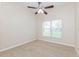 Bright bedroom with large window and ceiling fan at 1111 Partin Dr, Kissimmee, FL 34744