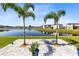 Backyard patio overlooking a peaceful lake at 1180 Lone Palm Way, Saint Cloud, FL 34771