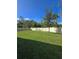 Large grassy backyard with privacy fence at 6097 Monterey Cypress Trl, Sanford, FL 32773