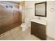 Updated bathroom with a vanity, toilet, and shower at 706 Tournament Ln, Kissimmee, FL 34759