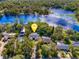 Aerial view of house near lake, highlighting its location and proximity to water at 143 Debary Dr, Debary, FL 32713