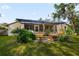 House backyard with deck and pergola, providing shade and seating at 143 Debary Dr, Debary, FL 32713