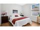 Bright bedroom with a comfortable bed and wood floors at 1780 Grand Oak Dr, Apopka, FL 32703