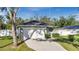 Front view of a house with a driveway at 1780 Grand Oak Dr, Apopka, FL 32703