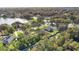 Aerial view of community near a lake at 1780 Grand Oak Dr, Apopka, FL 32703