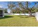 Spacious backyard with large tree and fence at 1780 Grand Oak Dr, Apopka, FL 32703