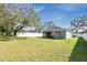 Spacious backyard with large tree and fenced perimeter at 1780 Grand Oak Dr, Apopka, FL 32703