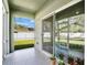 Relaxing screened porch with view of backyard at 1780 Grand Oak Dr, Apopka, FL 32703