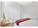 Simple bedroom with a bed and double door closet at 1780 Grand Oak Dr, Apopka, FL 32703