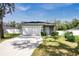 Front view of a house with a driveway at 1780 Grand Oak Dr, Apopka, FL 32703