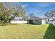 Large backyard with a green house at 1780 Grand Oak Dr, Apopka, FL 32703