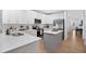 Modern kitchen with white cabinets, stainless steel appliances, and a large island at 1780 Grand Oak Dr, Apopka, FL 32703