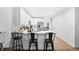 Kitchen with breakfast bar, stainless steel appliances, and stylish metal stools at 1780 Grand Oak Dr, Apopka, FL 32703