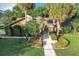 Single Gathering home with a walkway, landscaping, and palm trees at 956 Stonewood Ln, Maitland, FL 32751