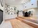 Open dining room with hardwood floors, fireplace, and built-in shelving at 956 Stonewood Ln, Maitland, FL 32751