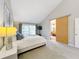 Main bedroom with sliding barn door to the bathroom at 956 Stonewood Ln, Maitland, FL 32751