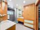 Modern bathroom with dark tile and wooden cabinetry at 956 Stonewood Ln, Maitland, FL 32751