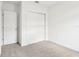 Bright bedroom with double door closet and neutral carpeting at 2110 Rosewood Dr, Bartow, FL 33830