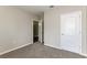Spacious bedroom with neutral carpeting and an open door to another room at 2036 Van Buren Loop, Auburndale, FL 33823