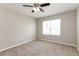 Bright bedroom with a large window, neutral walls, and carpeted floors at 2036 Van Buren Loop, Auburndale, FL 33823
