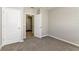 Bright bedroom featuring neutral walls, carpet, and white doors at 2036 Van Buren Loop, Auburndale, FL 33823