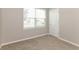 Cozy bedroom with a window, neutral walls and carpeted floors at 2036 Van Buren Loop, Auburndale, FL 33823