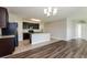 Modern kitchen with dark wood cabinets, granite countertops and stainless steel appliances at 2036 Van Buren Loop, Auburndale, FL 33823