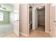 Bathroom with toilet, closet, and access to another bedroom at 2036 Van Buren Loop, Auburndale, FL 33823