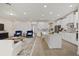 Open concept kitchen with white cabinetry, large island, and stainless steel appliances at 9747 Lost Creek Dr, Winter Garden, FL 34787