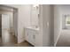 Clean bathroom with white vanity, tile shower, and neutral tile floor at 9747 Lost Creek Dr, Winter Garden, FL 34787