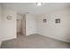 Simple bedroom with carpet flooring and an adjacent bathroom at 9747 Lost Creek Dr, Winter Garden, FL 34787