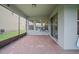Screened patio with brick flooring and backyard view at 9747 Lost Creek Dr, Winter Garden, FL 34787