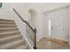 Elegant entryway with tile floors, a staircase, and a modern front door at 9747 Lost Creek Dr, Winter Garden, FL 34787