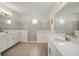 Elegant bathroom with a walk-in shower, double vanity, and modern fixtures at 9747 Lost Creek Dr, Winter Garden, FL 34787