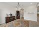 Bright dining room with tile floor, decorative rug, and built-in hutch at 9747 Lost Creek Dr, Winter Garden, FL 34787