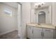 Bathroom with vanity, sink, and walk-in closet at 9747 Lost Creek Dr, Winter Garden, FL 34787