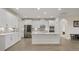 Bright kitchen with white cabinets, center island, and stainless steel appliances at 9747 Lost Creek Dr, Winter Garden, FL 34787