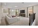 Large bonus room featuring a sectional sofa and plenty of natural light at 9747 Lost Creek Dr, Winter Garden, FL 34787