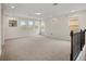 Spacious bonus room with neutral carpeting and multiple windows at 9747 Lost Creek Dr, Winter Garden, FL 34787