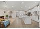 Modern kitchen boasts white cabinets, quartz countertops, and tile backsplash at 9747 Lost Creek Dr, Winter Garden, FL 34787