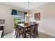 Bright dining room with a square table and six chairs, near sliding doors at 3819 Brighton Park Cir., Orlando, FL 32812