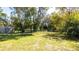 Spacious backyard with a shed and lush greenery at 796 Humphrey Cir, Deltona, FL 32738