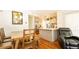 Bright kitchen and dining area, featuring granite countertops and hardwood floors at 796 Humphrey Cir, Deltona, FL 32738