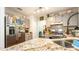 Modern kitchen with granite countertops and stainless steel appliances at 796 Humphrey Cir, Deltona, FL 32738