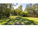 Large backyard with mature trees and a fenced perimeter at 796 Humphrey Cir, Deltona, FL 32738