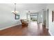 Relaxing living room with hardwood floors, recessed lighting and access to a patio at 22011 Belgian Ct, Mount Dora, FL 32757