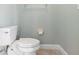 Small powder room with toilet and sink at 22011 Belgian Ct, Mount Dora, FL 32757